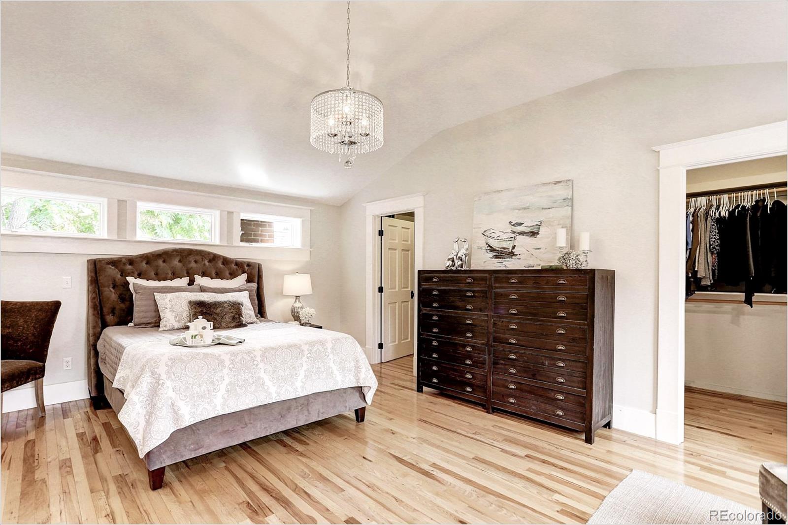 2735 West 35th Avenue Denver, CO 80211 - Photo 19 of 33 a bedroom with a bed and wooden floor
