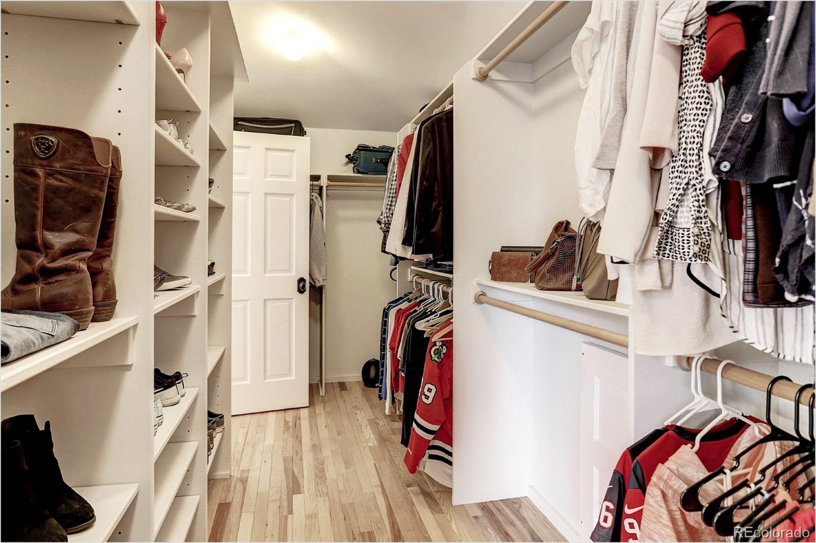 2735 West 35th Avenue Denver, CO 80211 - Photo 22 of 33 a view of walk in closet with clothes and shoes