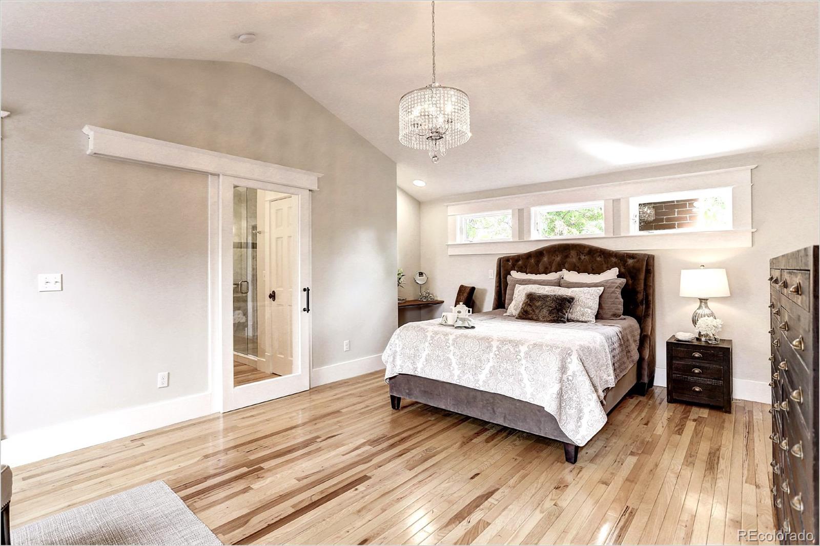 2735 West 35th Avenue Denver, CO 80211 - Photo 23 of 33 a bedroom with a bed and wooden floor