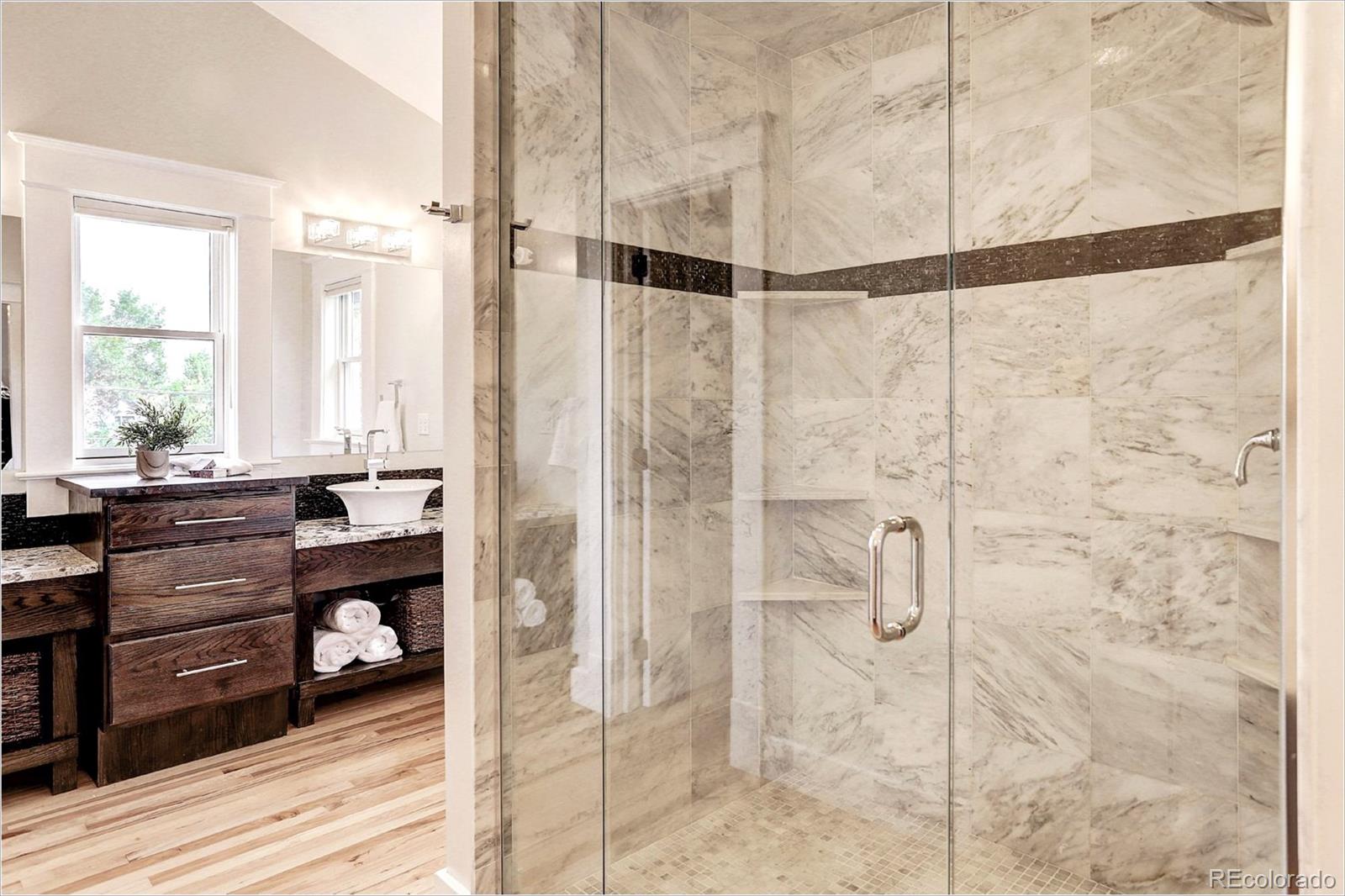 2735 West 35th Avenue Denver, CO 80211 - Photo 25 of 33 a bathroom with a shower and a window
