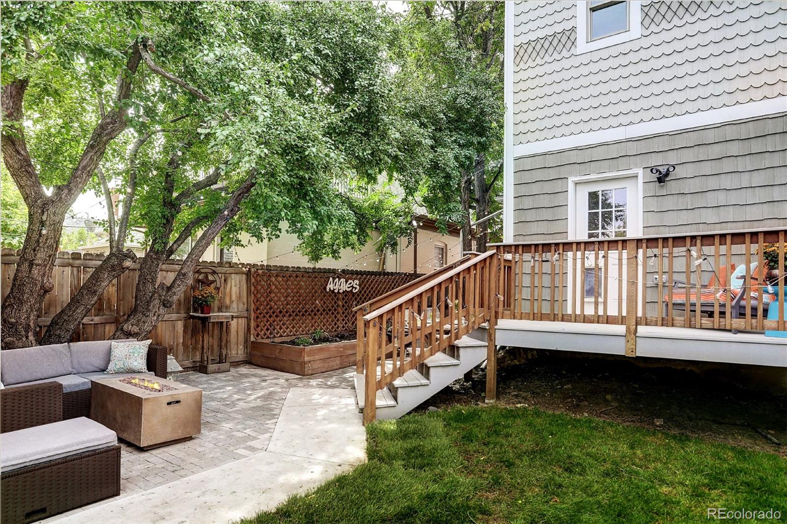 2735 West 35th Avenue Denver, CO 80211 - Photo 30 of 33 a view of a deck with couches and a potted plant on a patio