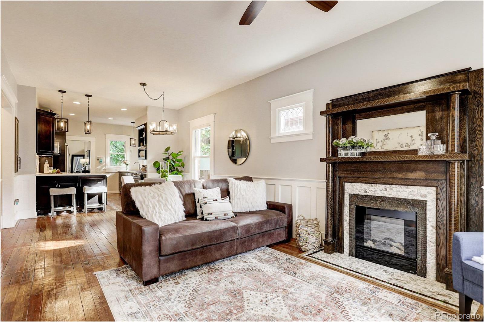 2735 West 35th Avenue Denver, CO 80211 - Photo 7 of 33 a living room with furniture and a fireplace