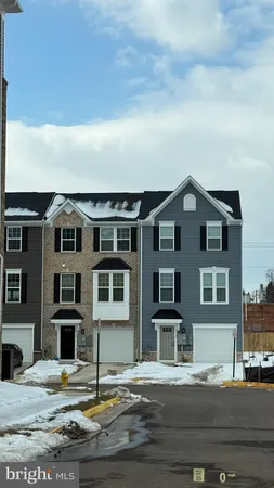 a view of multiple houses with a street