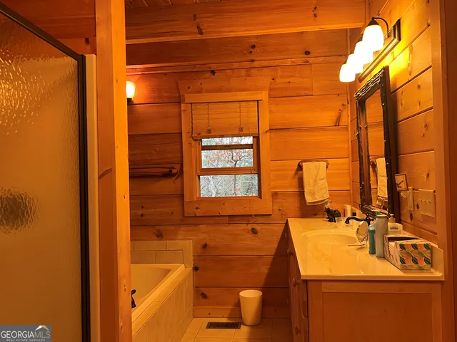 a bed sitting in a bedroom next to a building