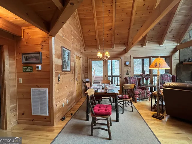 a kitchen with stainless steel appliances granite countertop a sink dishwasher and cabinets with wooden floor