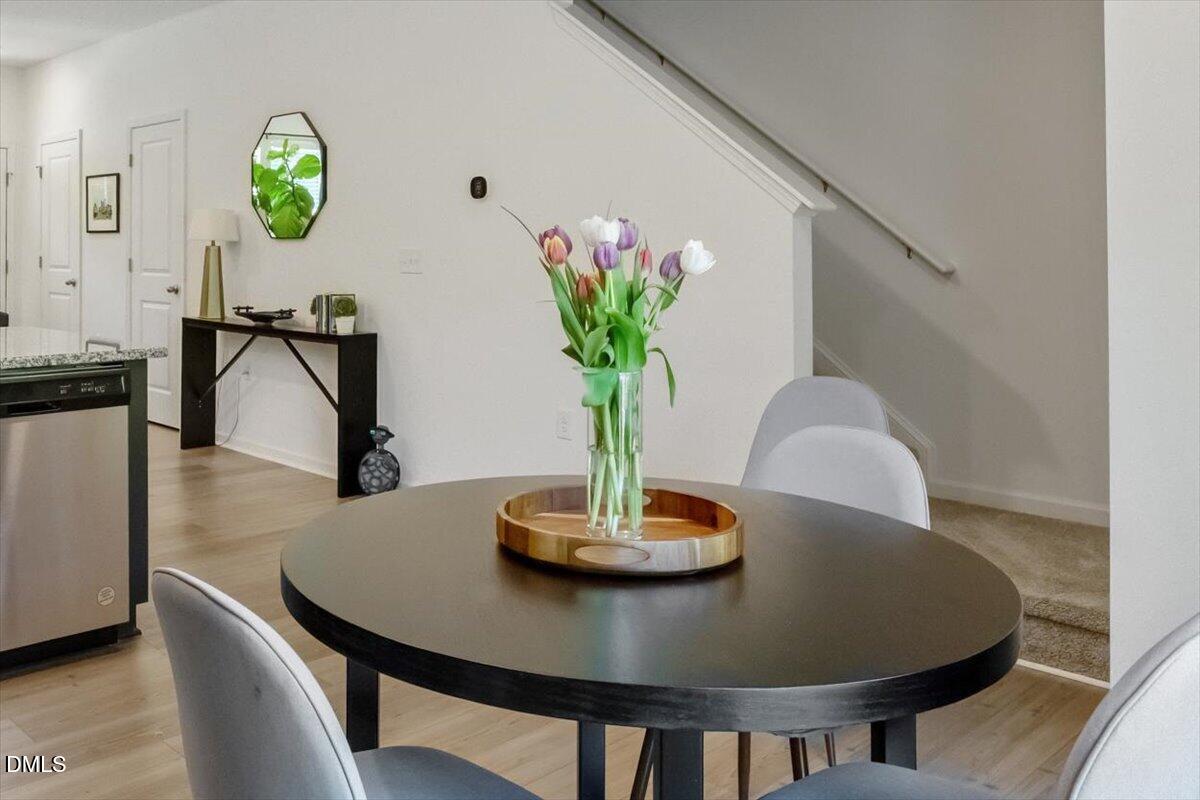 517 Hacksaw Trail Raleigh, NC 27610 - Photo 11 of 20 a view of a dining room with furniture and a potted plant