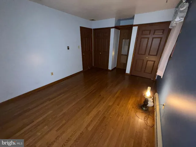 a view of room with wooden floor