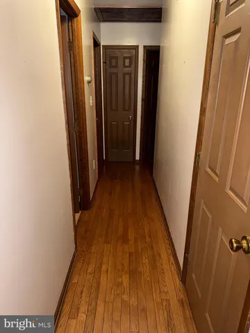 a view of entryway with wooden floor