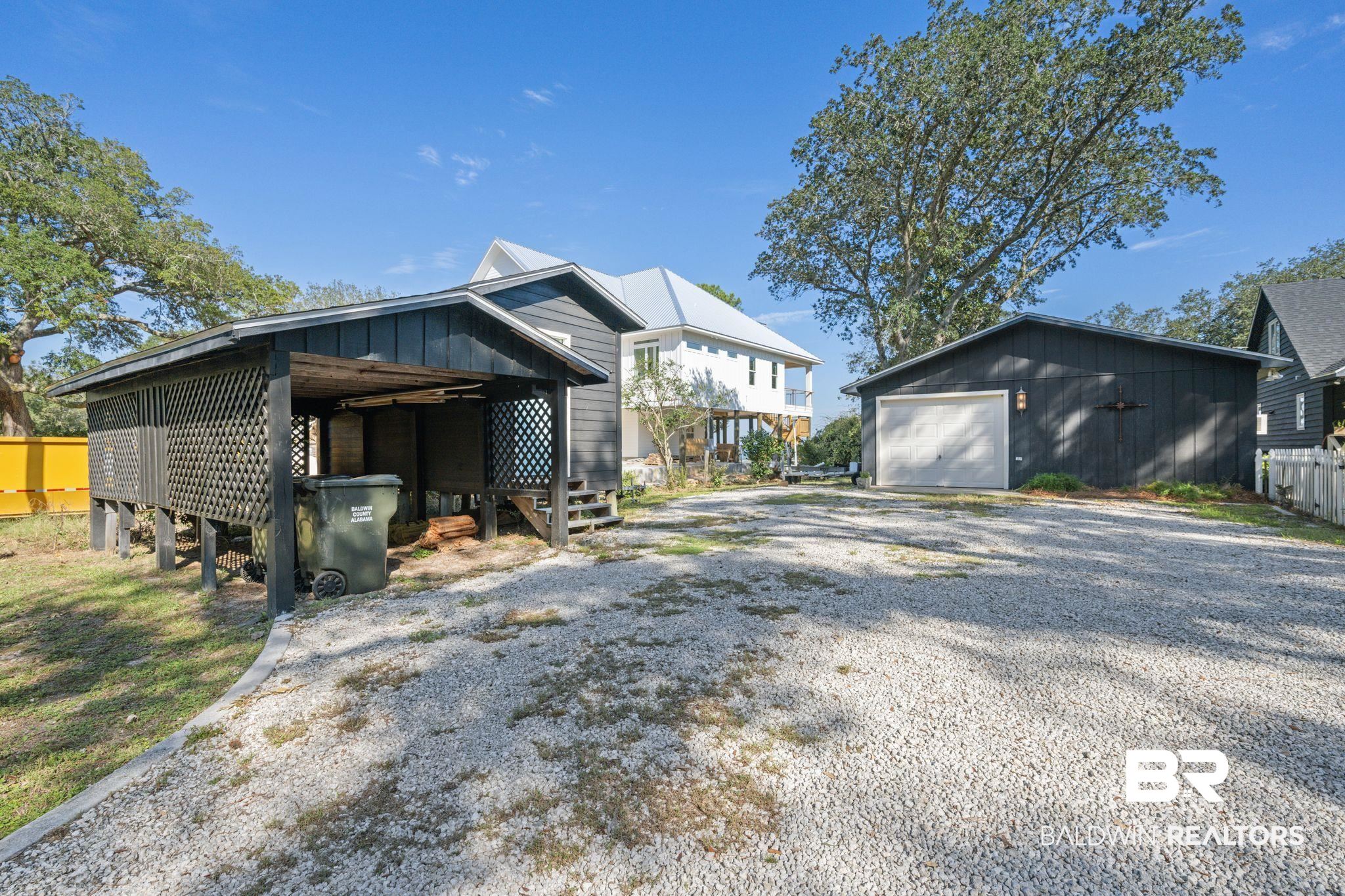 7646 Spring Branch Road Elberta, AL 36530 - Photo 56 of 85 Exterior space featuring an outdoor structure and a garage