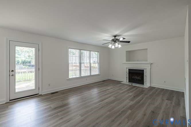 6118 Springwood Road Chester, VA 23831 - Photo 8 of 38 Spacious living area featuring wood-finish floorin