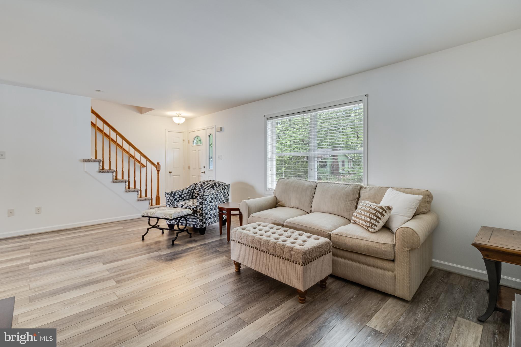 12015 Woodbury Road Nanjemoy, MD 20662 - Photo 15 of 53 a living room with furniture and a large window
