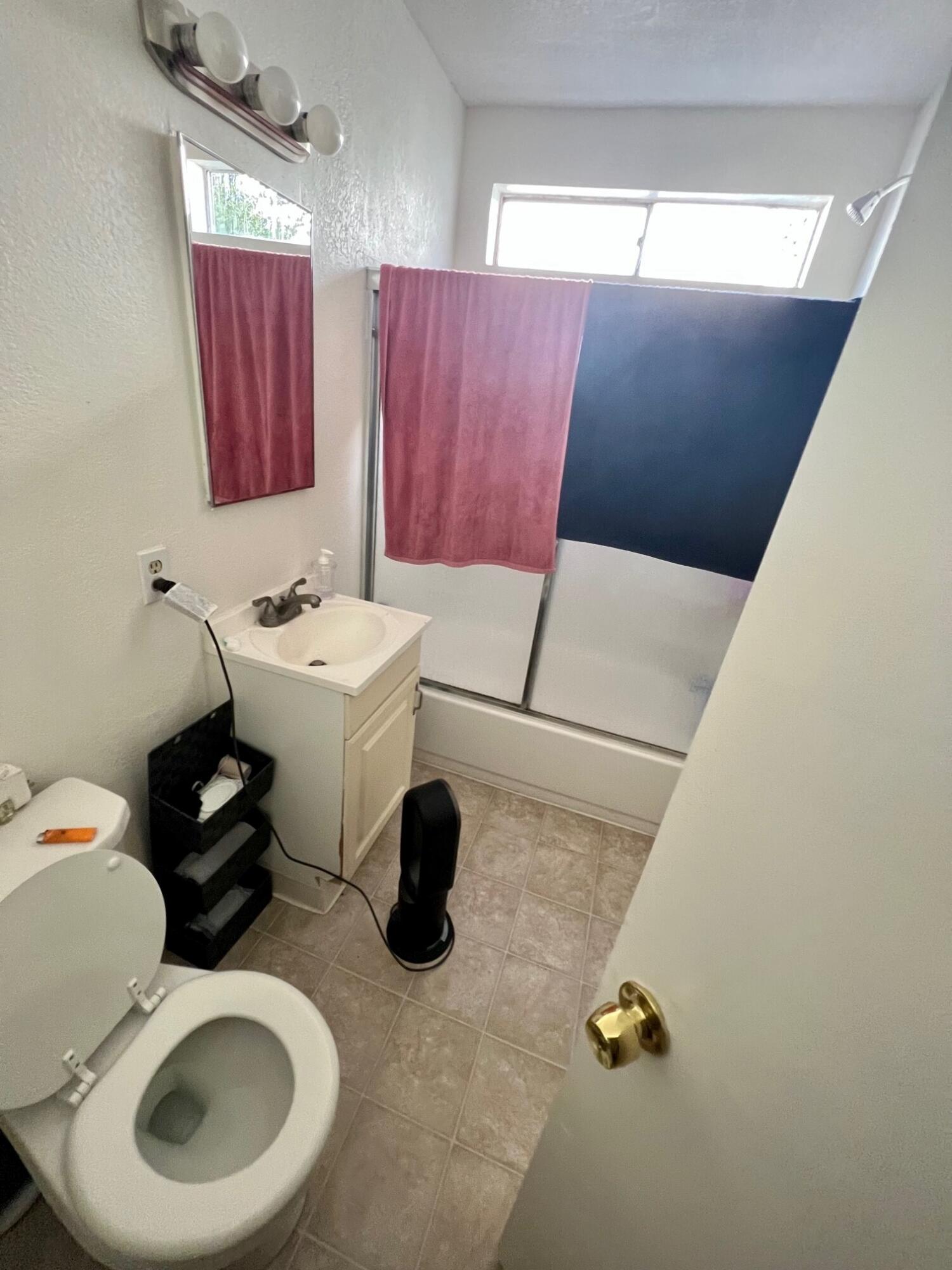 280 Mathilda Drive Goleta, CA 93117 - Photo 11 of 12 a bathroom with a sink mirror toilet and vanity