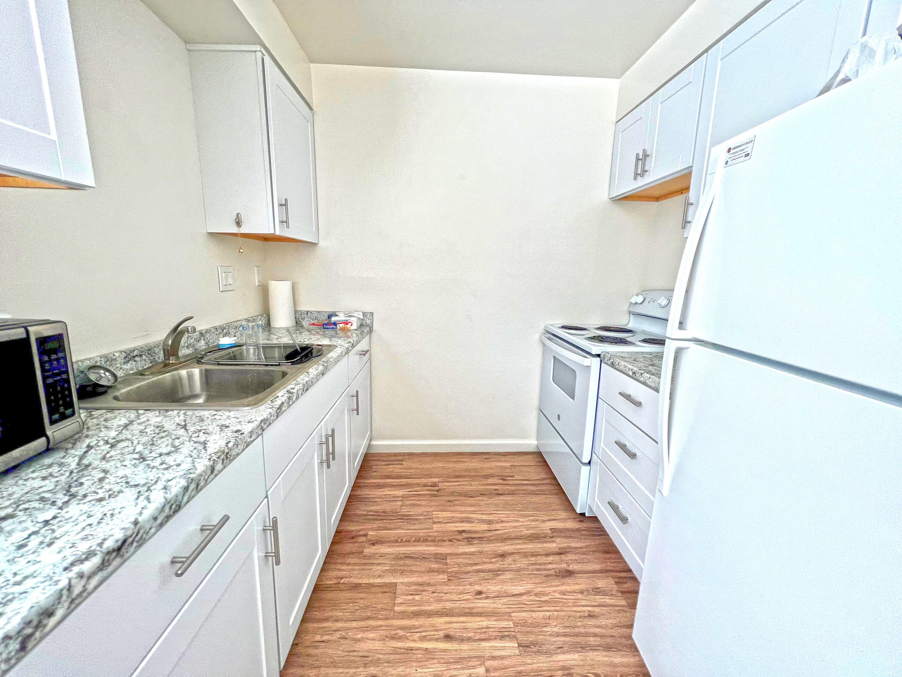 280 Mathilda Drive Goleta, CA 93117 - Photo 10 of 12 a kitchen with granite countertop a sink stove and refrigerator