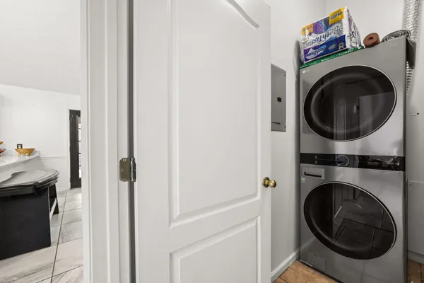 a view of a hallway with washer and dryer