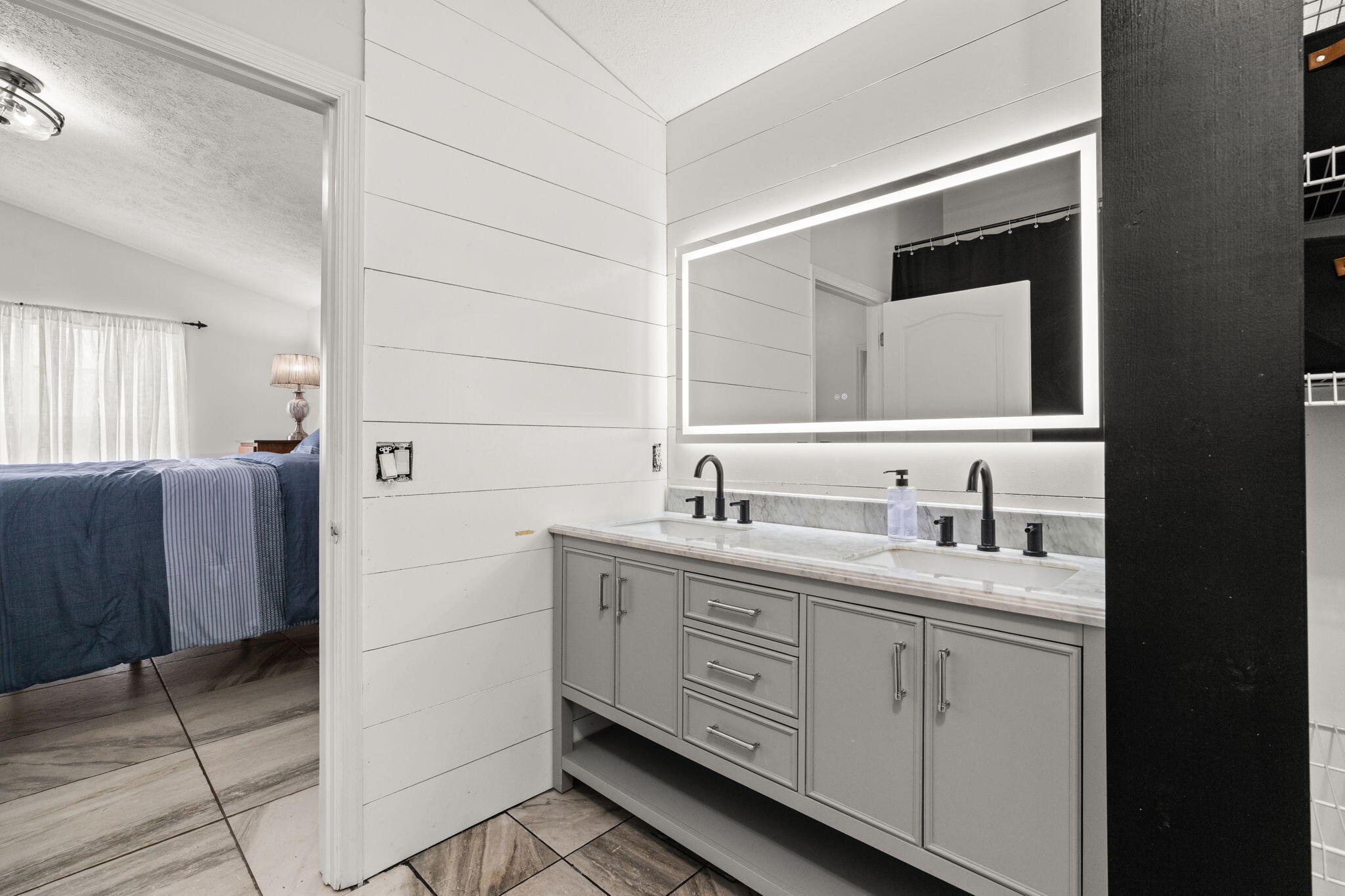 17826 Front Beach Road Panama City Beach, FL 32413 - Photo 21 of 34 a bathroom with a double vanity sink and mirror