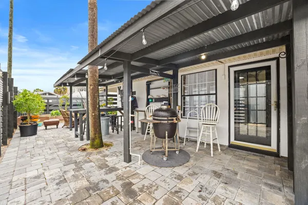 a view of a porch with chairs in patio