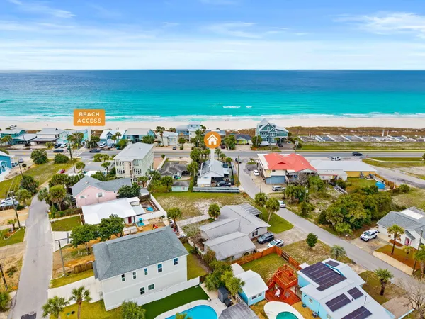 an aerial view of residential houses with outdoor space