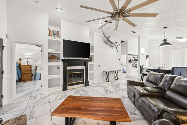 a living room with furniture and a flat screen tv