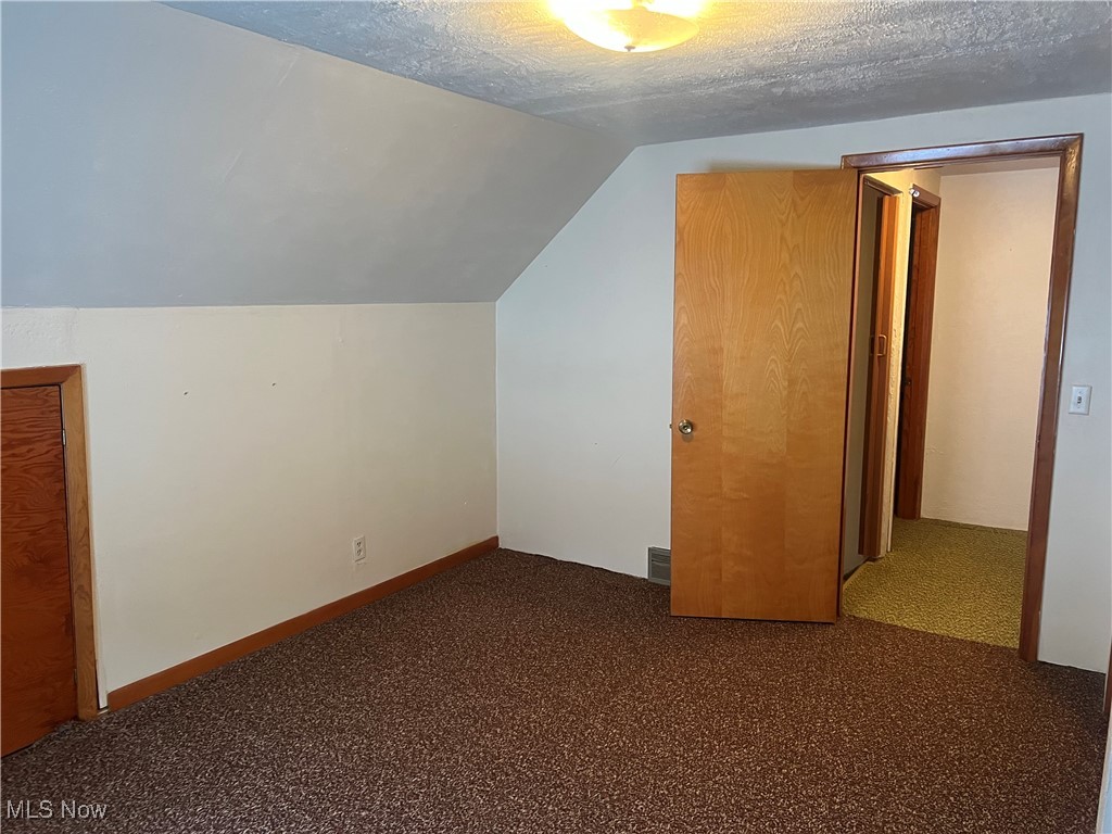 7296 Poore Road Conneaut, OH 44030 - Photo 21 of 27 upstairs bedroom, carpet floors, and a textured ceiling