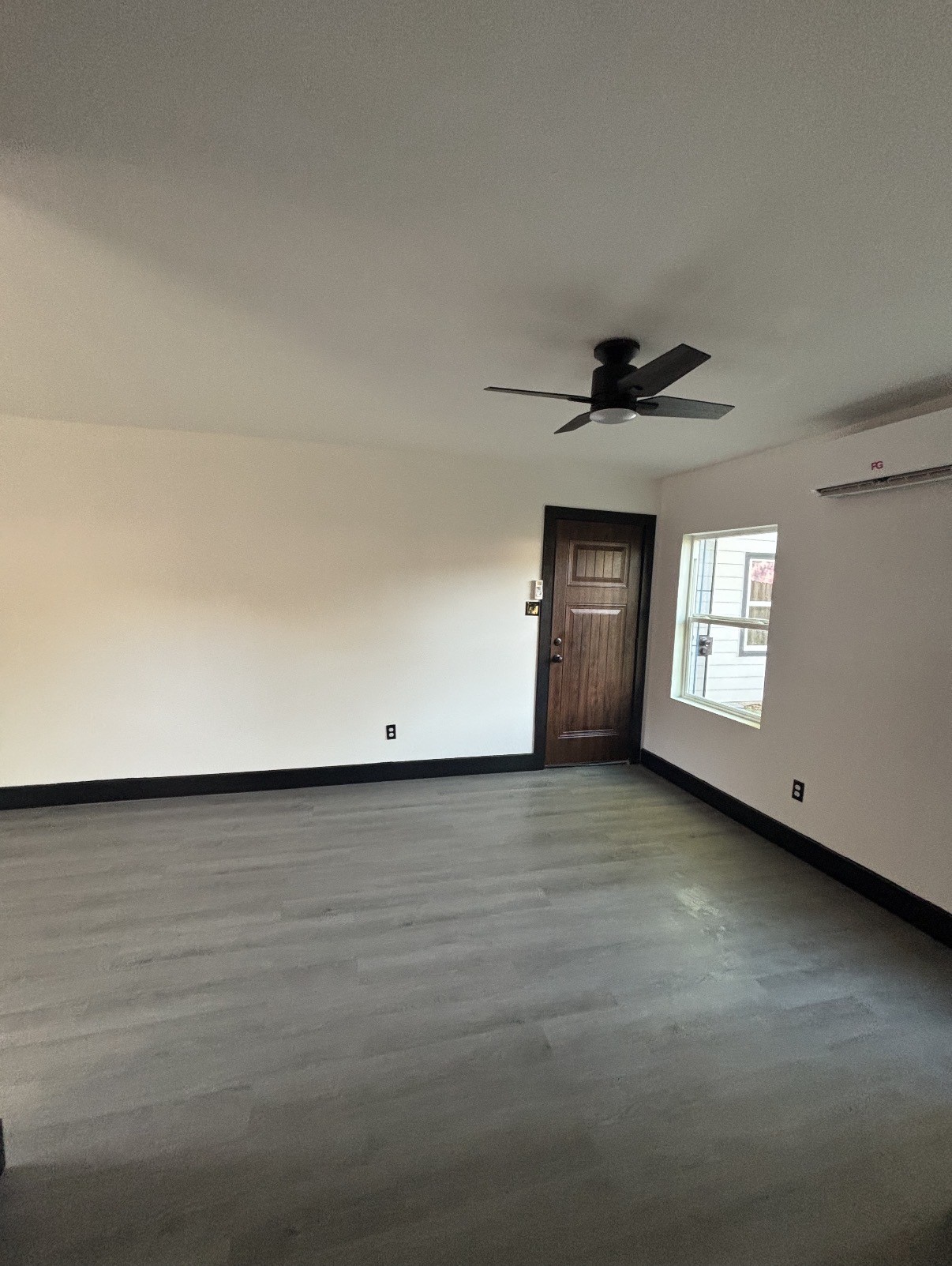 7213 Moline Street, Unit 1 Houston, TX 77087 - Photo 7 of 10 a view of an empty room with a window and fireplace