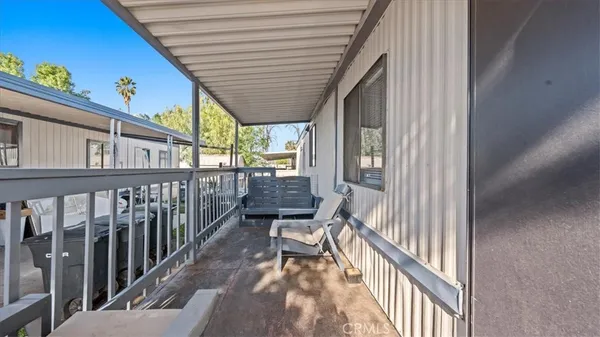 a view of a balcony and chairs