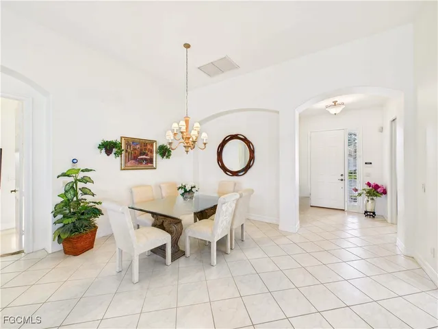 a view of a dining room and kitchen