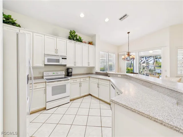 a kitchen with appliances cabinets and a sink