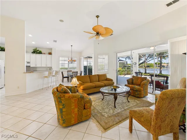 a living room with furniture a window and a table
