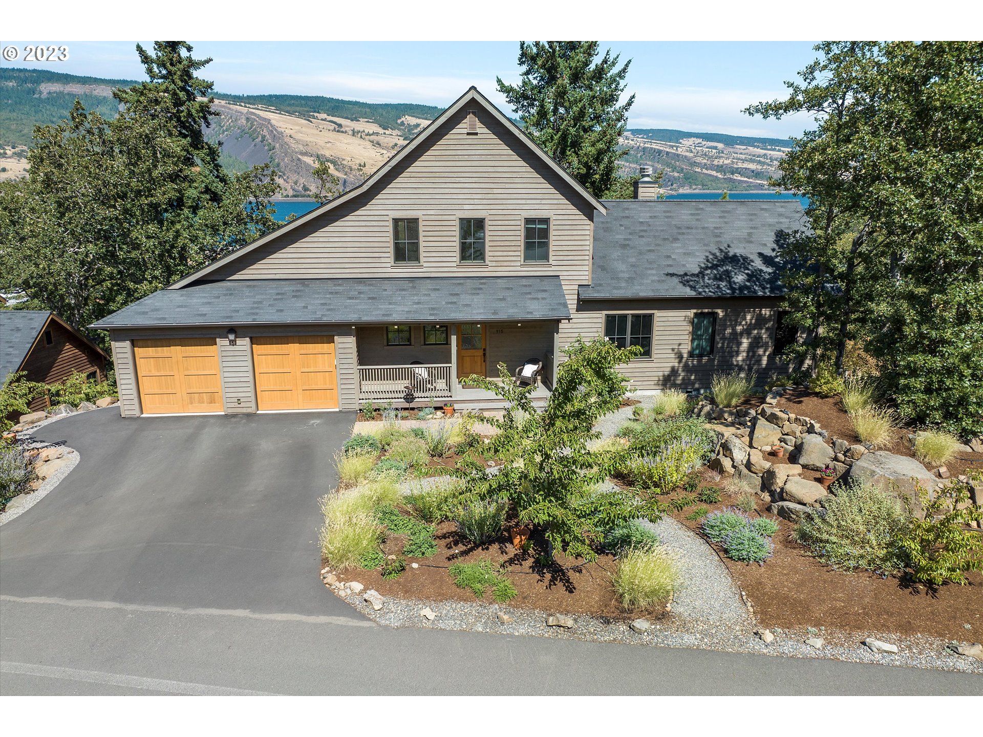 915 Fifth Avenue Mosier, OR 97040 - Photo 1 of 34 a view of a backyard of the house