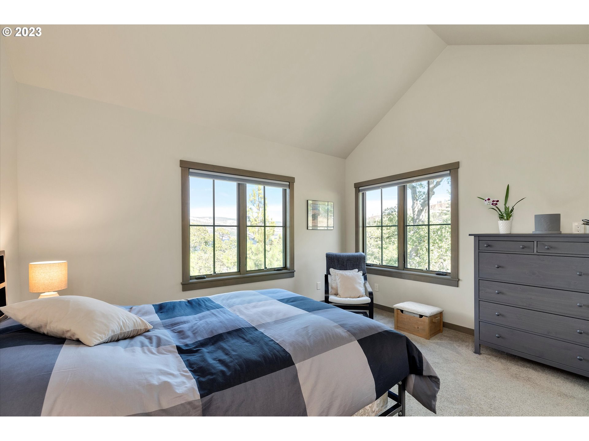 915 Fifth Avenue Mosier, OR 97040 - Photo 11 of 34 a bedroom with a bed and a window