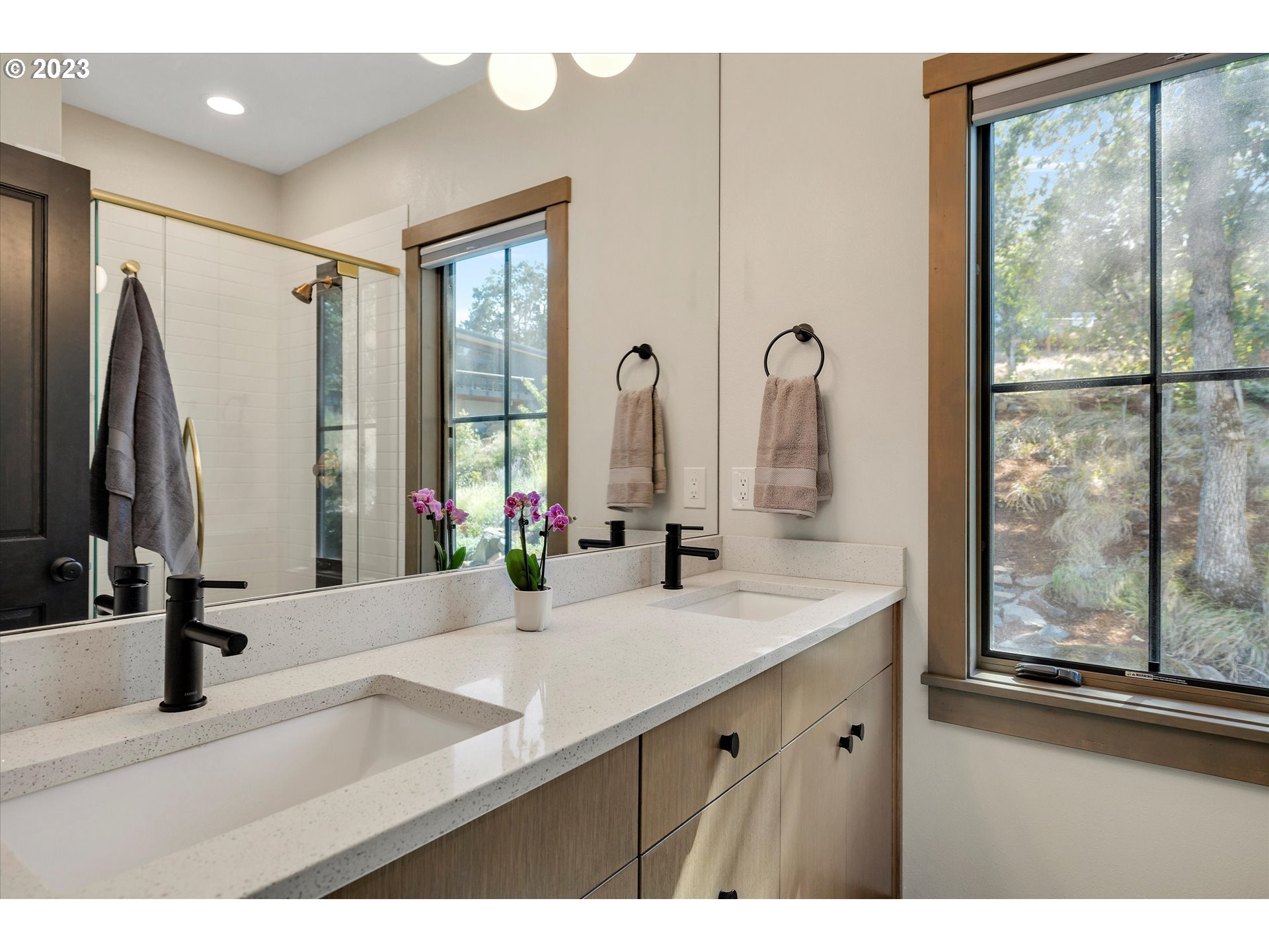 915 Fifth Avenue Mosier, OR 97040 - Photo 13 of 34 a bathroom with a double vanity sink and a mirror