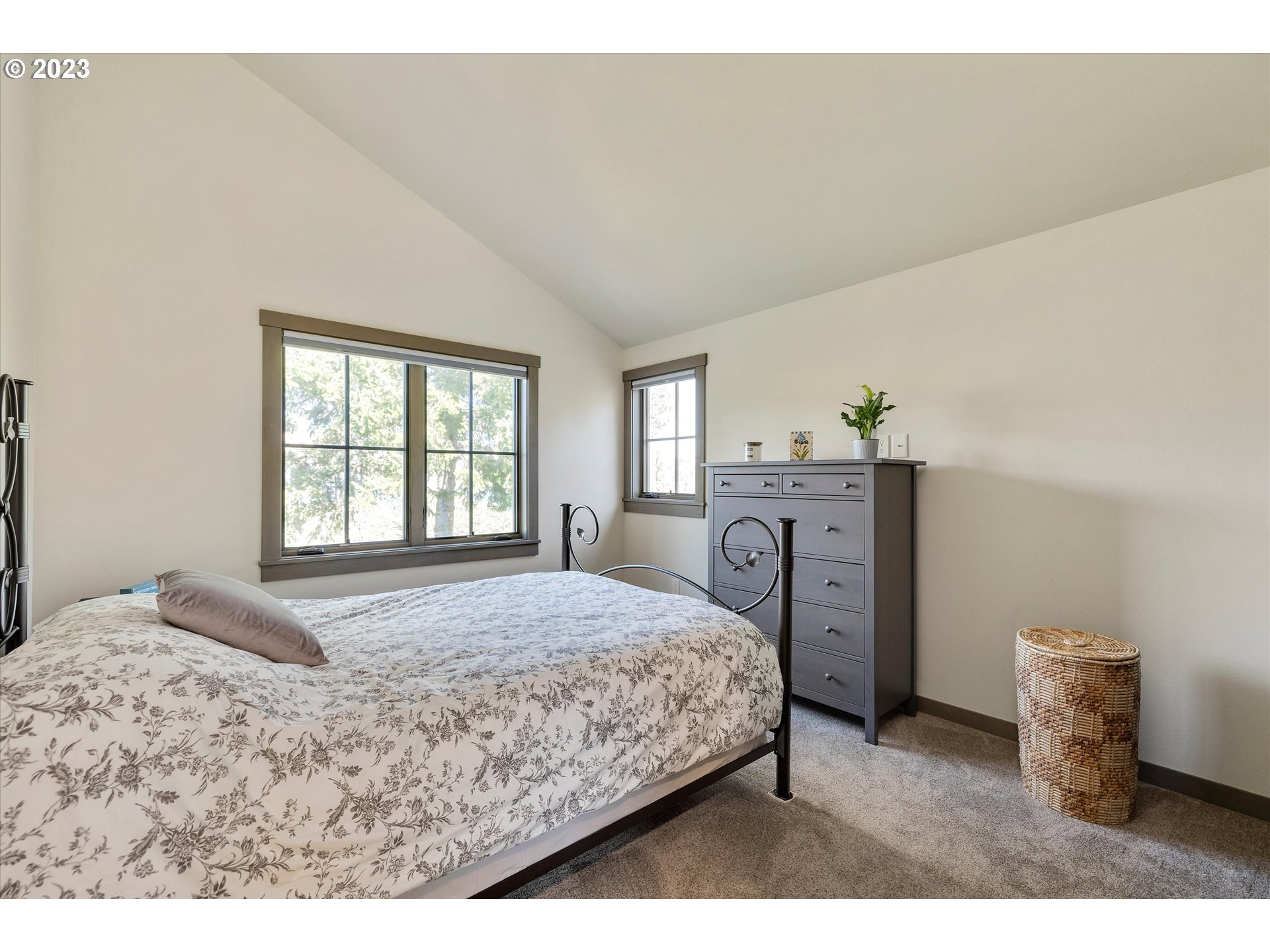 915 Fifth Avenue Mosier, OR 97040 - Photo 15 of 34 a bedroom with a bed and windows