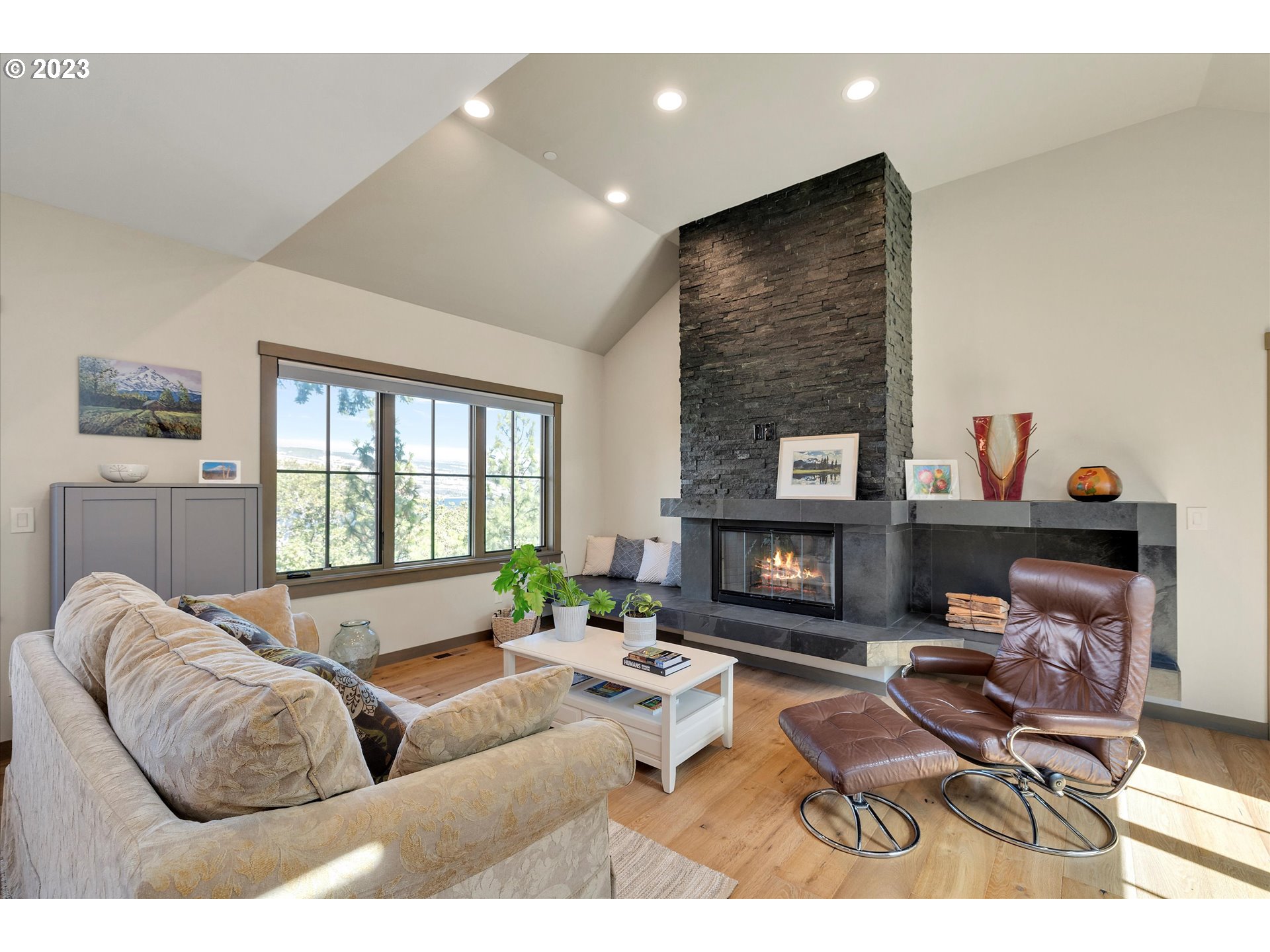 915 Fifth Avenue Mosier, OR 97040 - Photo 2 of 34 a living room with furniture and a fireplace