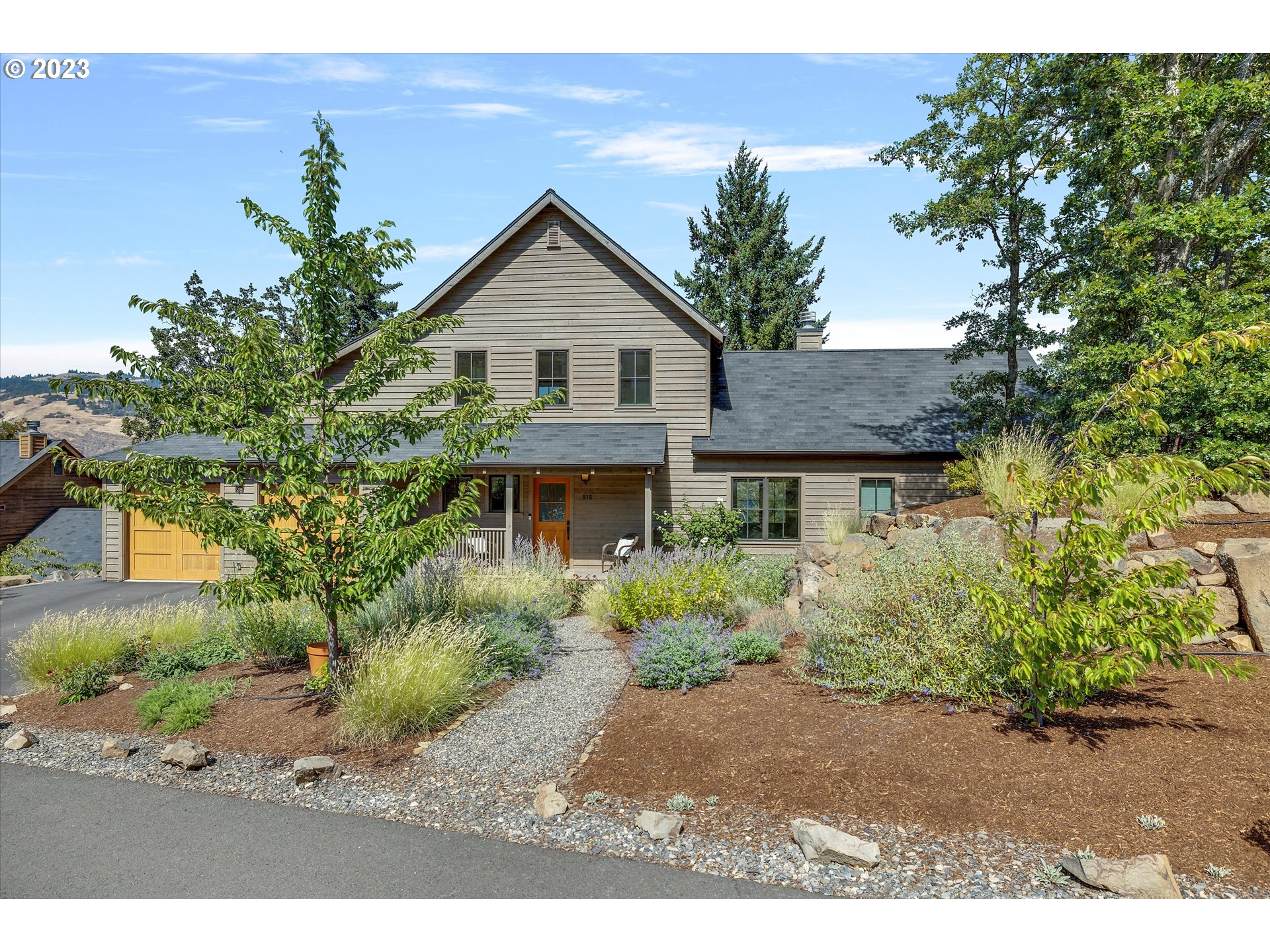 915 Fifth Avenue Mosier, OR 97040 - Photo 34 of 34 a front view of a house with a garden