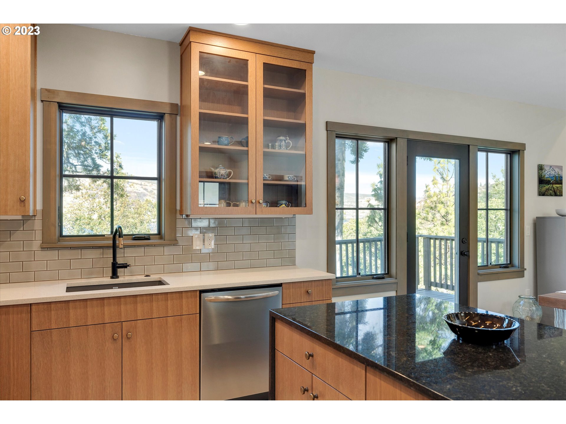 915 Fifth Avenue Mosier, OR 97040 - Photo 8 of 34 a kitchen with a sink and large window