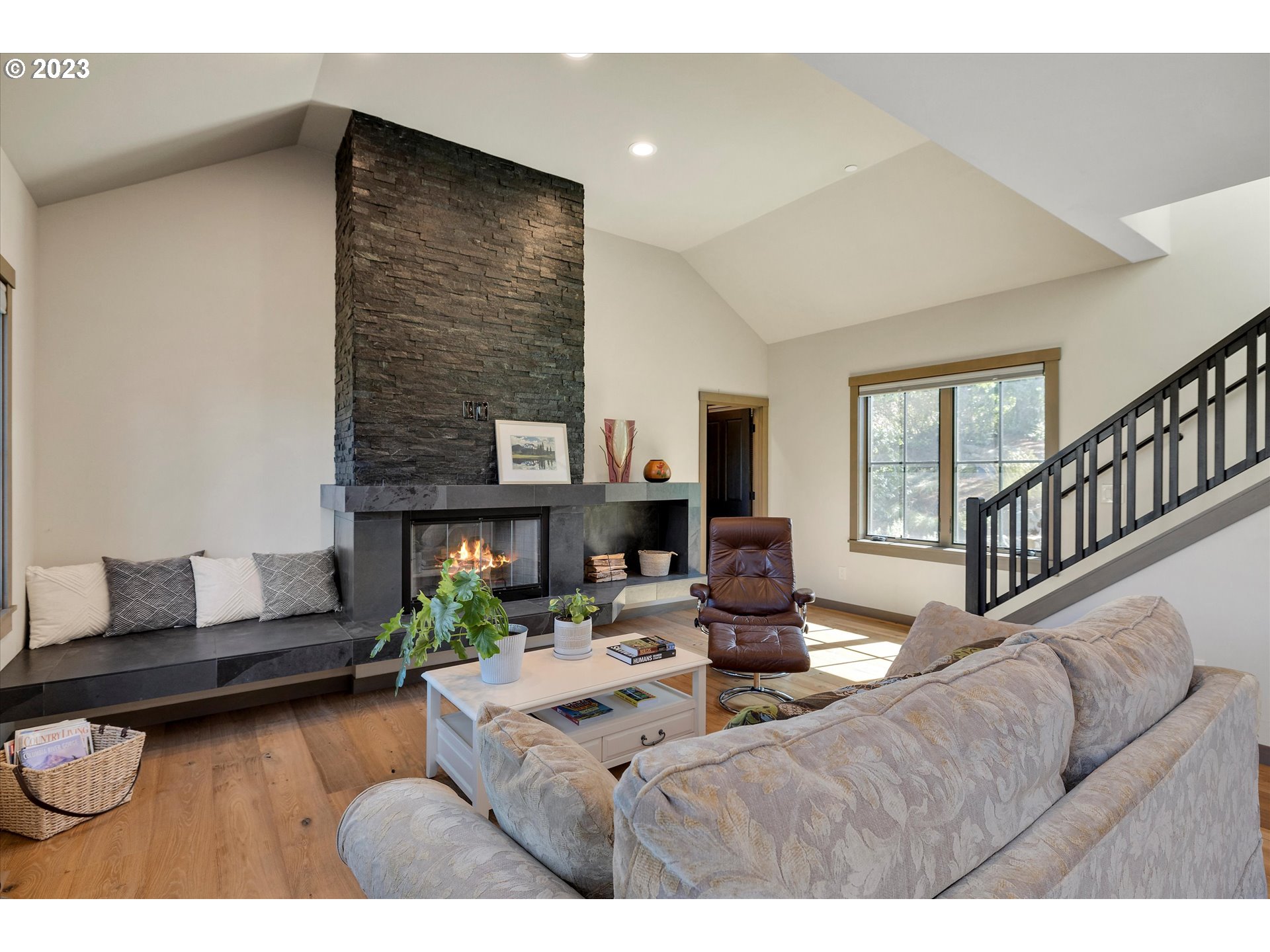 915 Fifth Avenue Mosier, OR 97040 - Photo 10 of 34 a living room with furniture and a fireplace