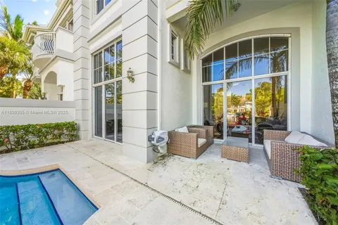 a kitchen with stainless steel appliances granite countertop a stove sink and cabinets