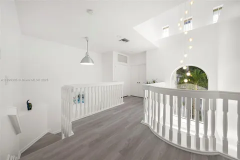 a bedroom with a bed a desk and chair