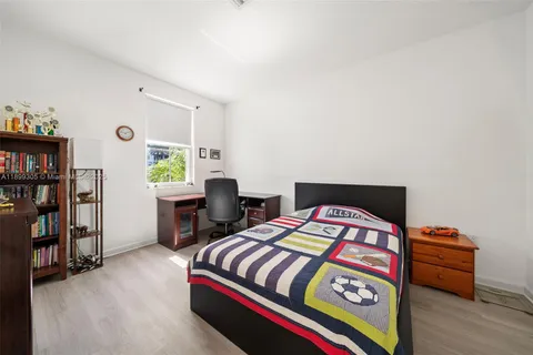 a view of living room and kitchen with furniture and floor to ceiling window