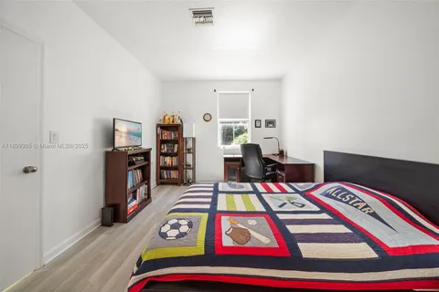 a bathroom with a tub and shower
