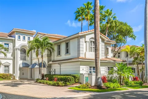 a view of a dining room with furniture and a potted plant