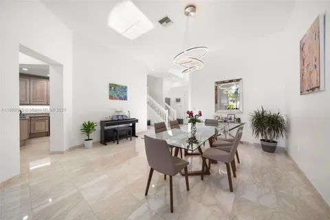 a living room with furniture or couch and a dining table