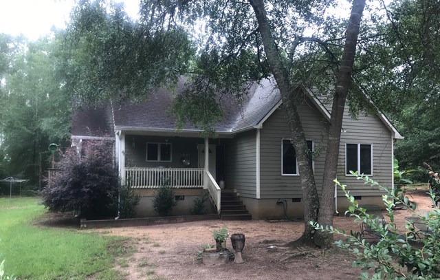 818 Forsling Road Reynolds, GA 31076 - Photo 1 of 35 a view of a house with a yard and sitting area