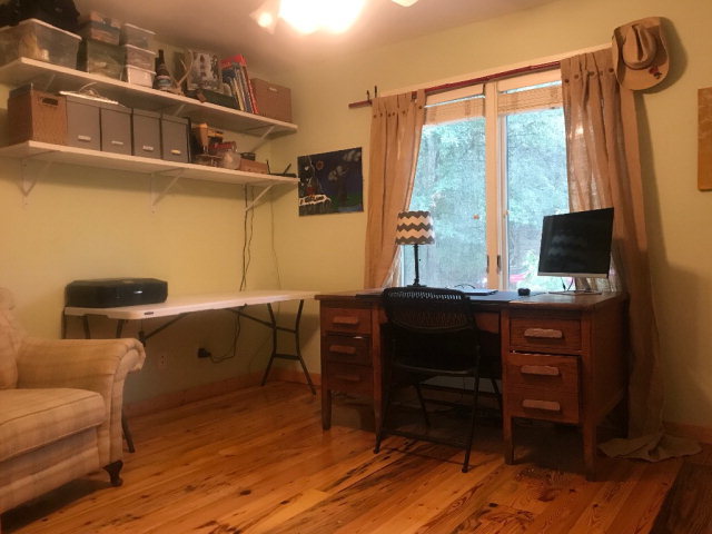 818 Forsling Road Reynolds, GA 31076 - Photo 12 of 35 a room with a chair and large windows