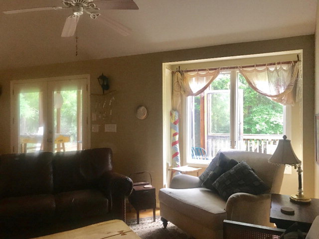 818 Forsling Road Reynolds, GA 31076 - Photo 3 of 35 a living room with furniture and a large window
