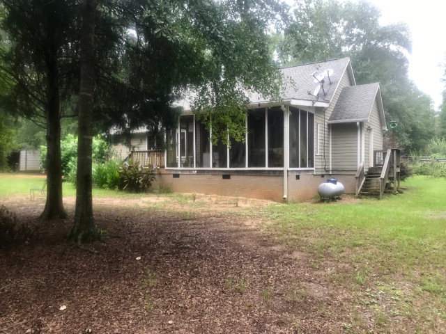 818 Forsling Road Reynolds, GA 31076 - Photo 31 of 35 a front view of a house with garden