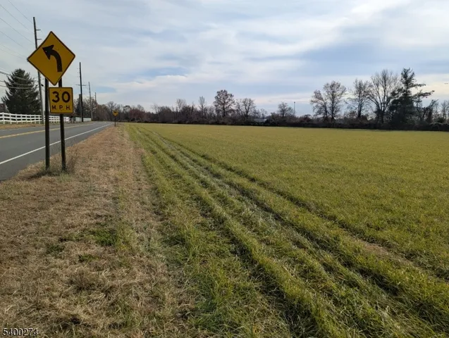 a view of a street with an ocean view