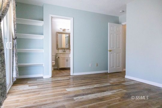 1012 Conejo Avenue Ridgecrest, CA 93555 - Photo 11 of 24 a view of a room with wooden floor and closet