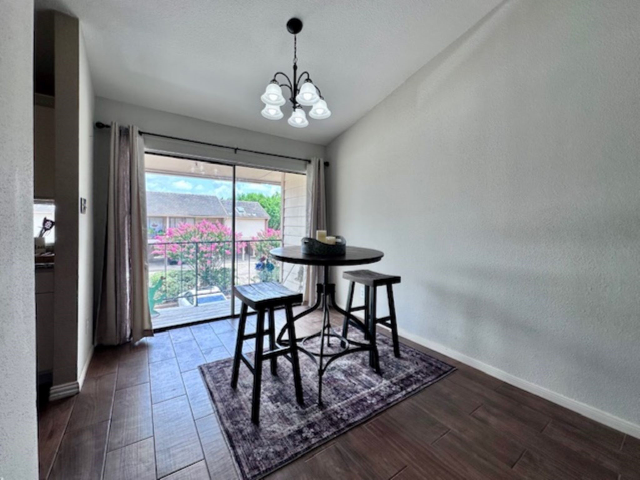 2211 South Kirkwood Road, Unit 35 Houston, TX 77077 - Photo 4 of 13 Dining room features same wood-like tile flooring that carries into the kitchen.