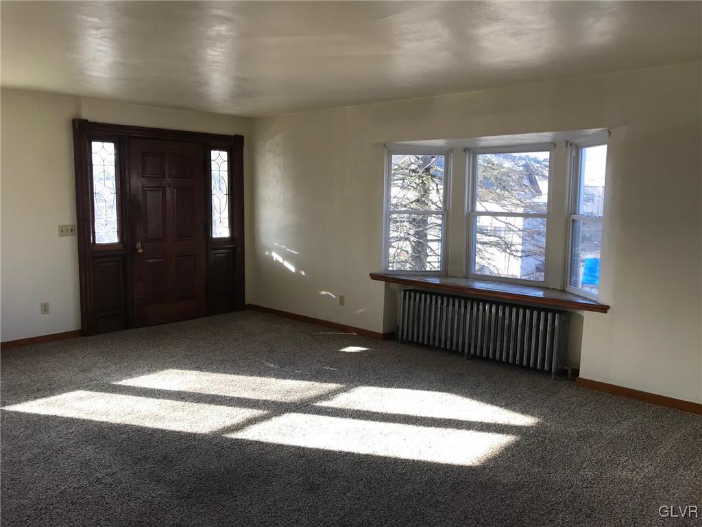 306 1st Street, Unit 1 Slatington, PA 18080 - Photo 3 of 11 a view of an empty room with a window
